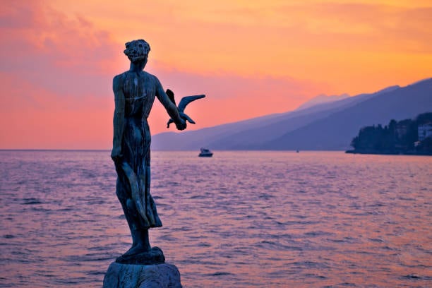 The Maiden with the Seagull statue by the sea in Opatija