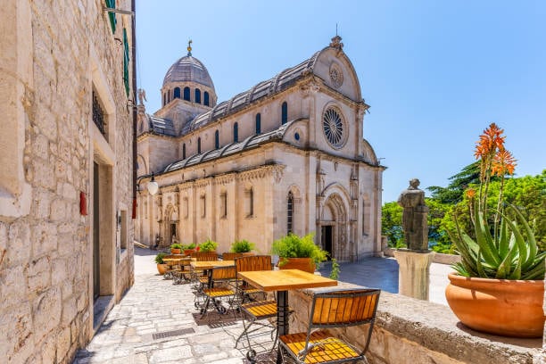 Cathedral of St James in Šibenik seen from a stone street