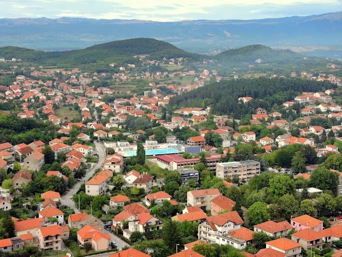 Aerial view of Sinj with hills behind the town